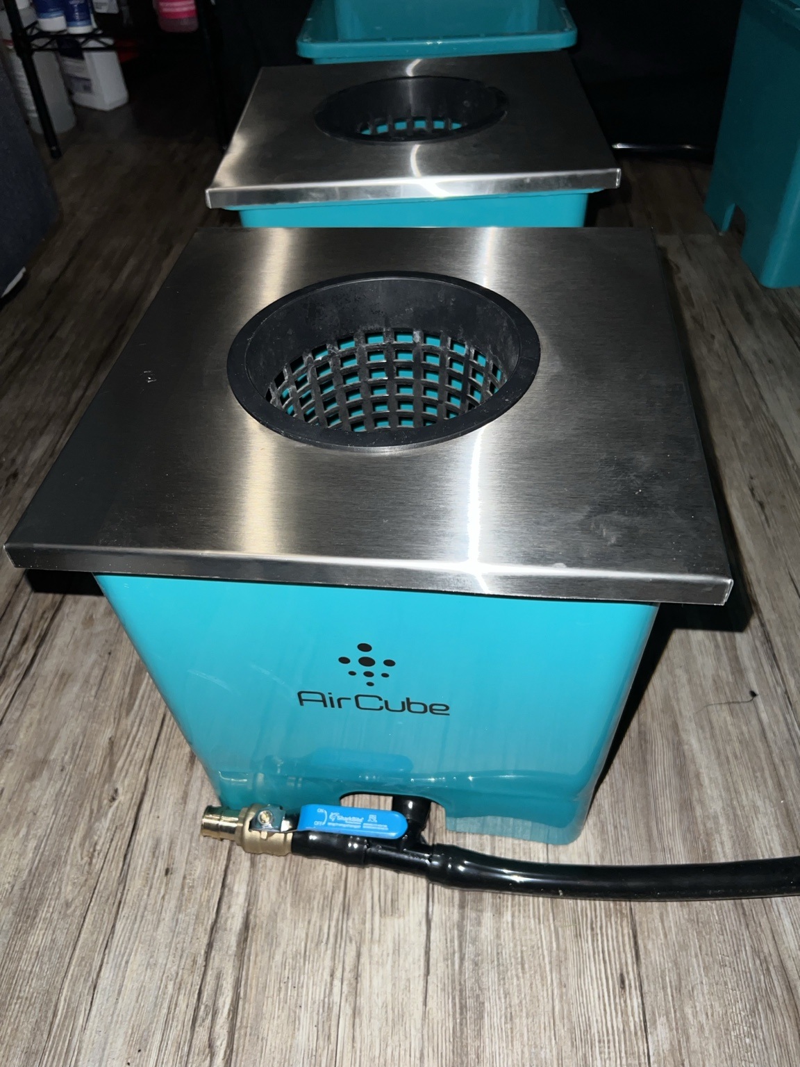 Six-inch single-opening stainless steel lid installed on an AirCube-compatible bucket
